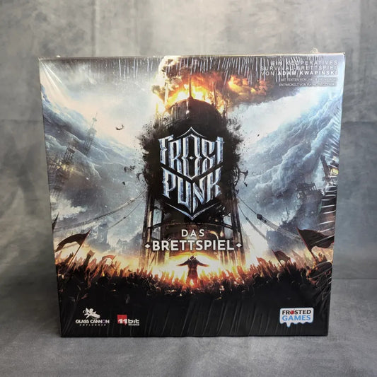 Das Bild zeigt die Schachtel für Frostpunk: Das Brettspiel von Frosted Games. Darin ist ein massiver Turm in einer verschneiten, postapokalyptischen Szene mit Menschenmengen darunter abgebildet, der die dystopische Steampunk-Atmosphäre des Spiels einfängt.