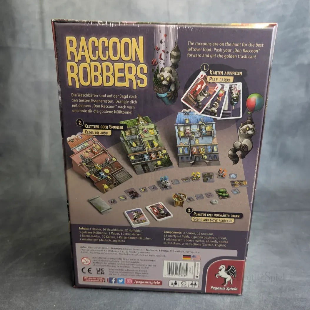Die Rückseite der Raccoon Robbers-Schachtel zeigt illustrierte Waschbären, Spielkomponenten, eine deutsche Beschreibung und das Pegasus Spiele-Logo.