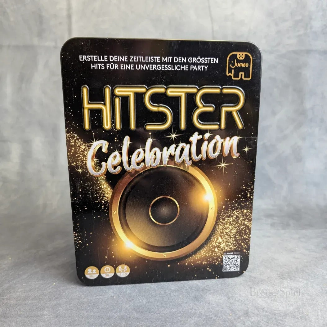 Die rechteckige Box für Hitster: Celebration von Jumbo Spiele zeigt einen goldenen Lautsprecher, Glitzer, deutschen Text auf schwarzem Hintergrund und das Jumbo Spiele-Logo in der oberen rechten Ecke.