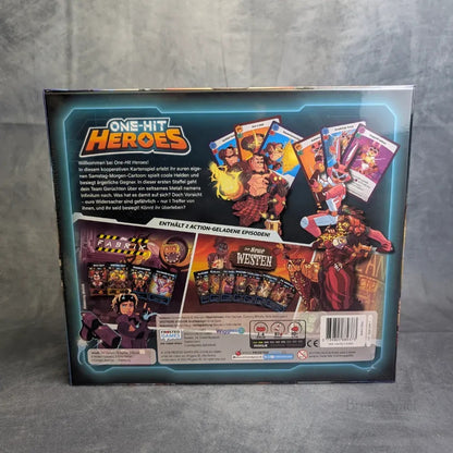Die Rückseite der One Hit Heroes-Schachtel von Frosted Games zeigt ein farbenfrohes deutsches Artwork und Helden, die dieses kooperative Kartenspiel und Boss-Rush-Spiel mit Karten, Komponenten und den wichtigsten Spieleigenschaften hervorheben.