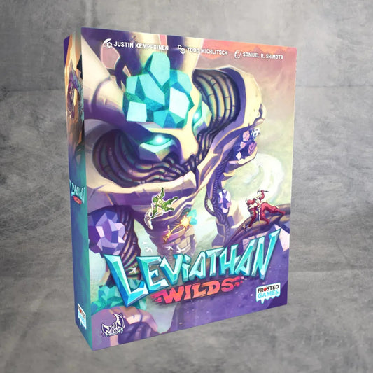 Leviathan Wilds von Frosted Games kommt in einer farbenfrohen Schachtel mit einer großen, gepanzerten Kreatur mit leuchtenden blauen Augen und kleinen Figuren, die auf ihr herumklettern, vor einem grau strukturierten Hintergrund.